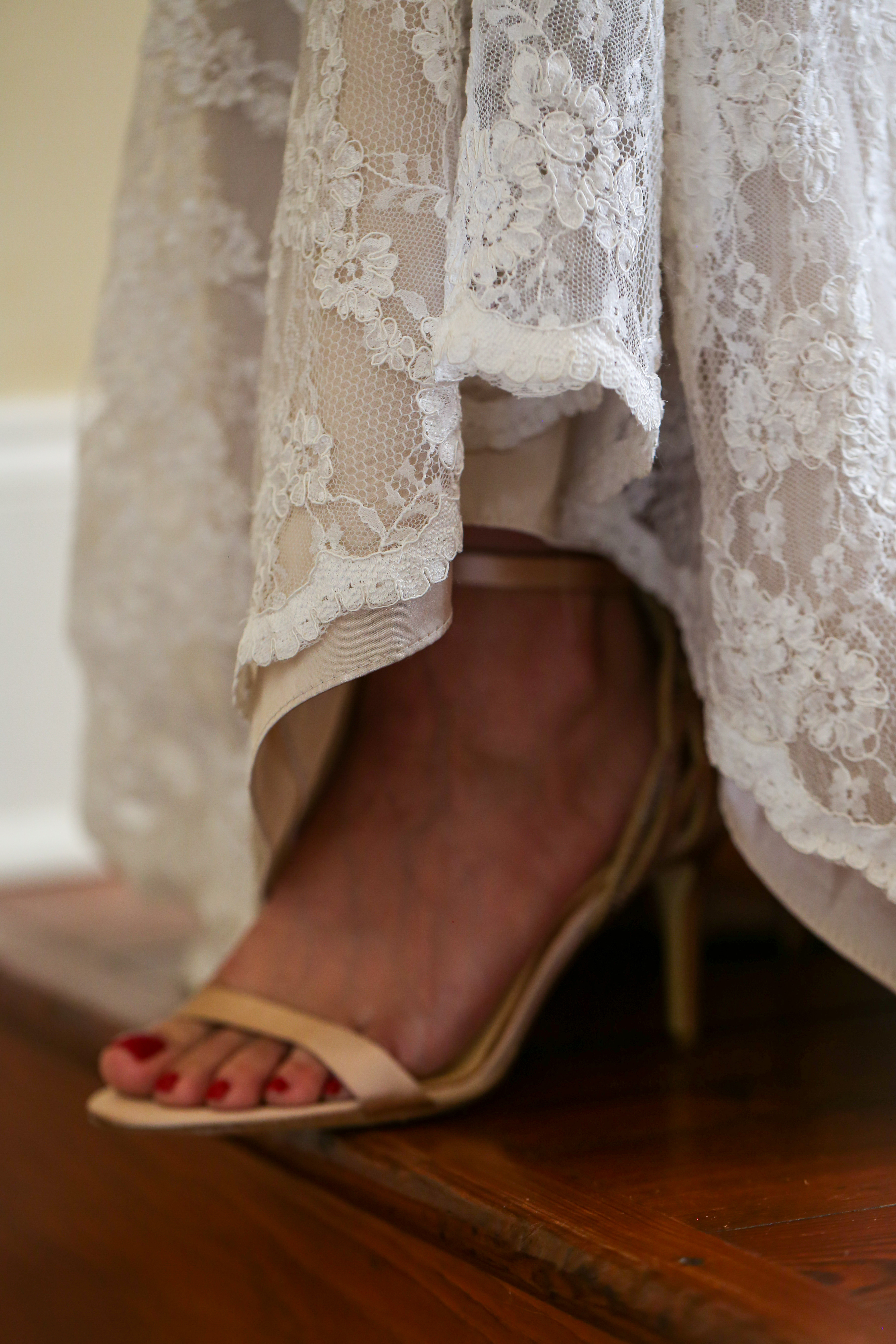 bride's high heel open toe shoe on antique stairs